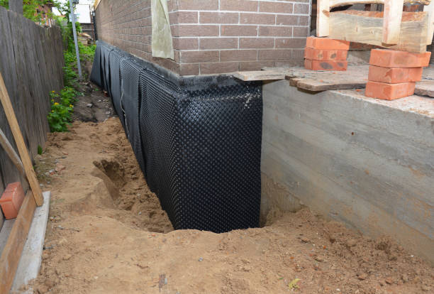 Happy homeowners after waterproofing job in Mountain Lakes